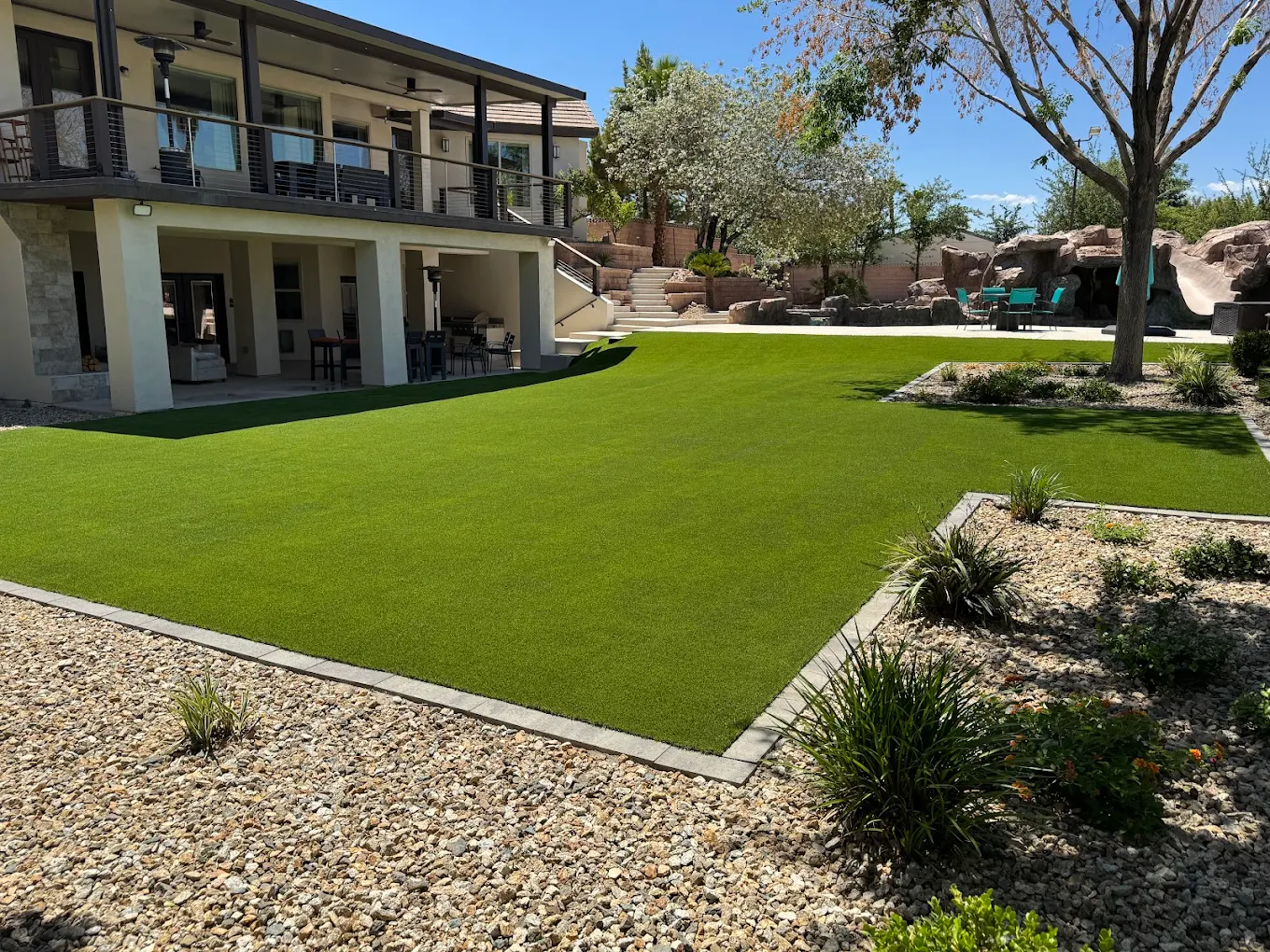 Luxury Henderson backyard with professionally installed artificial turf and outdoor living space