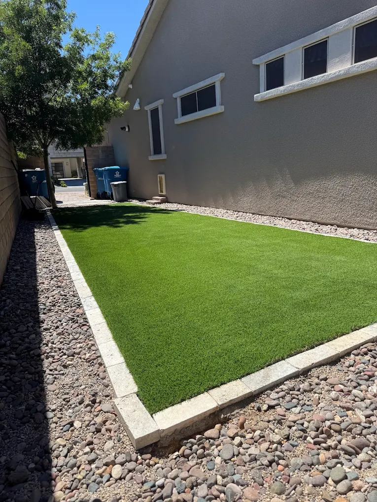 Side yard turf with gravel border on Henderson desert soil